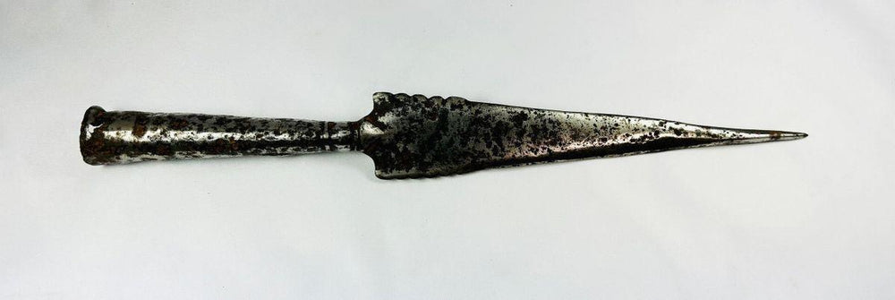Ancient European iron spearhead with scalloped-edge blade and socketed base