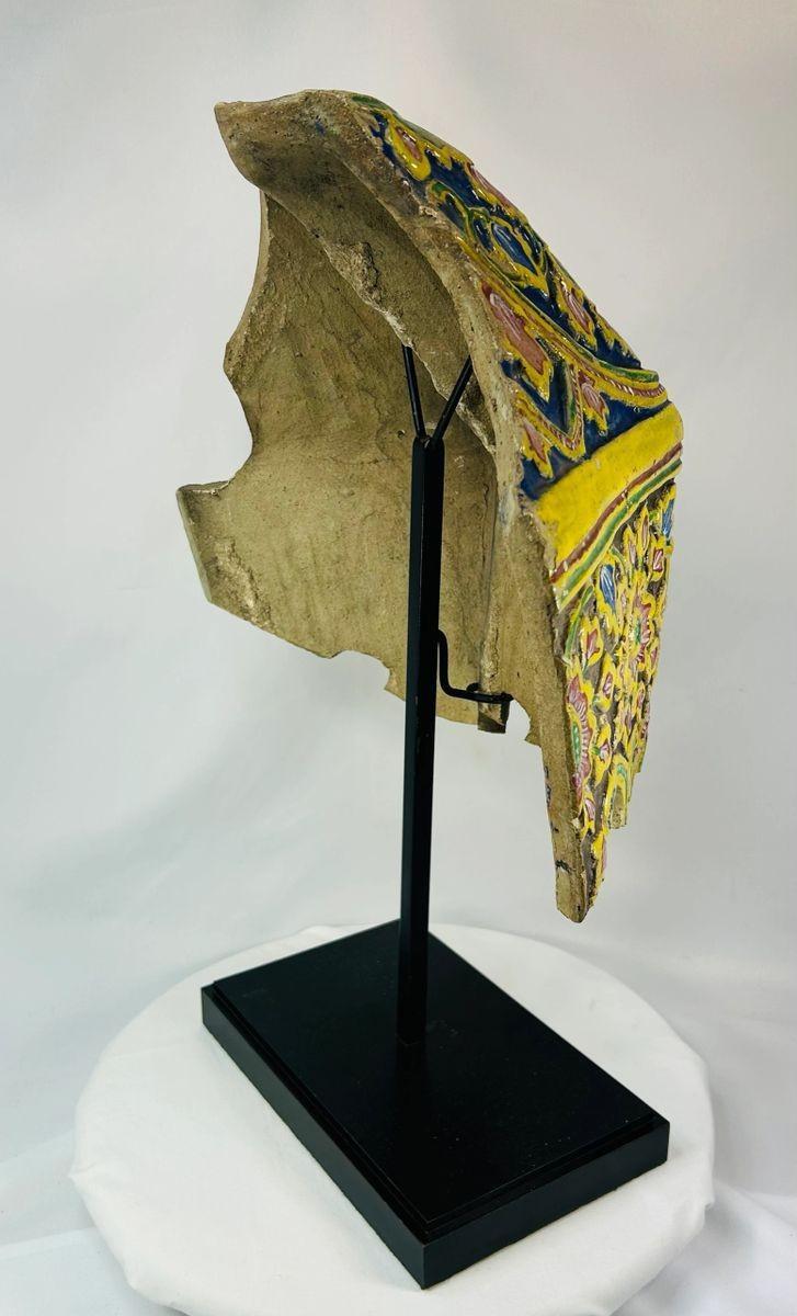 Thai ceramic corner tile with vibrant floral and geometric patterns