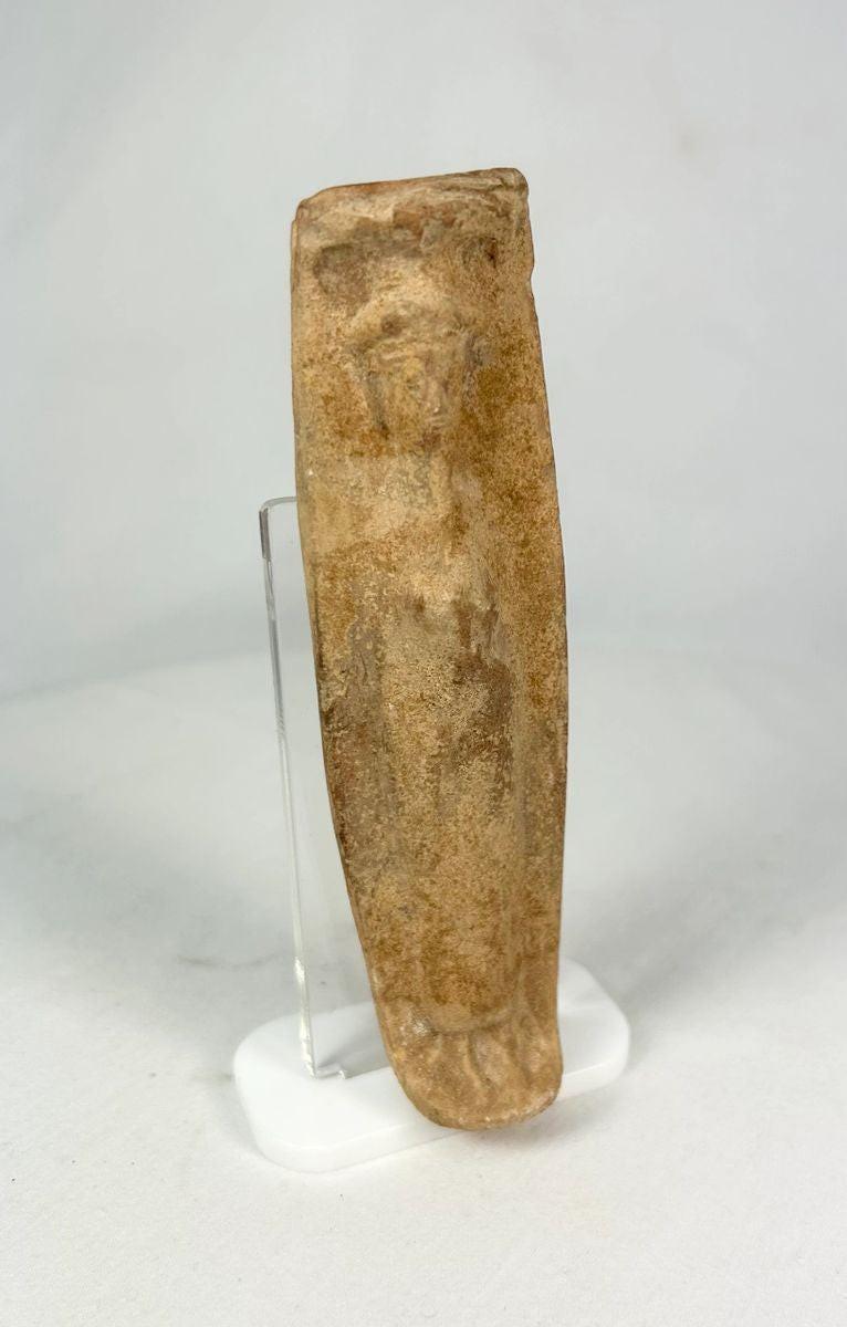 Side profile of a Roman terracotta fertility figurine used in household ritual