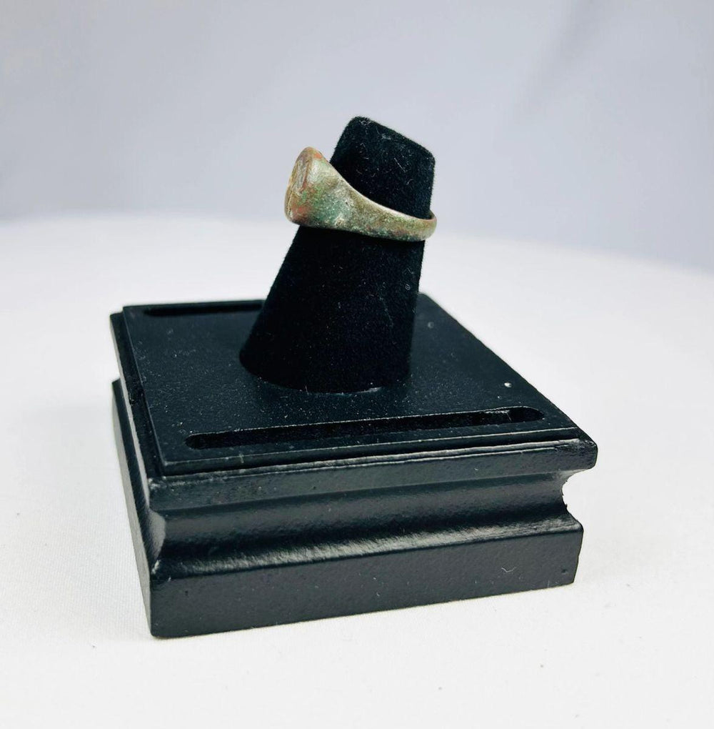 Ancient symbolic elephant ring in bronze, worn surface and intact engraved bezel