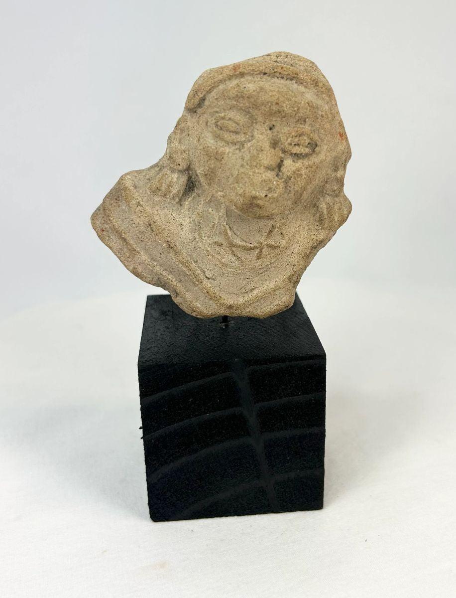 Ancient Mesoamerican terracotta fragment with incised chest details