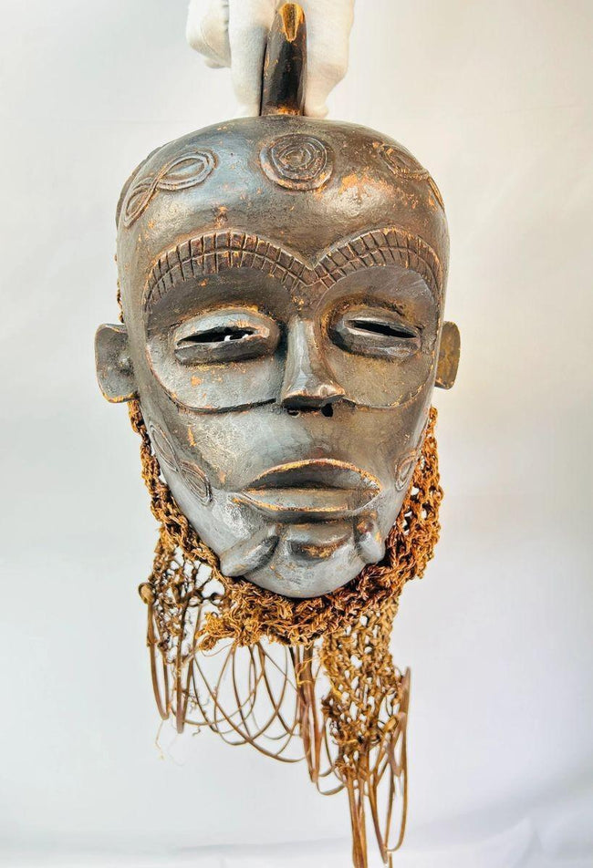 Chokwe mask from Central Africa showcasing serene expression and craftsmanship