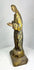 Close-up of a Spanish Colonial santo hand-carved wooden statue displaying surface wear and age