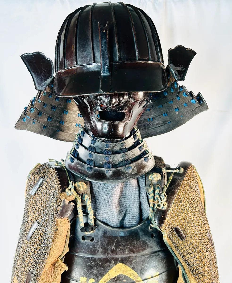 Fierce iron menpo facial armor with detachable nose and expressive design from Muromachi samurai suit.