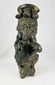 Stylized seated ceramic figure with intricate geometric decoration
