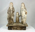 Carved wooden Spanish Colonial Holy Family santo on display