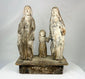 Carved wooden Spanish Colonial Holy Family santo on display