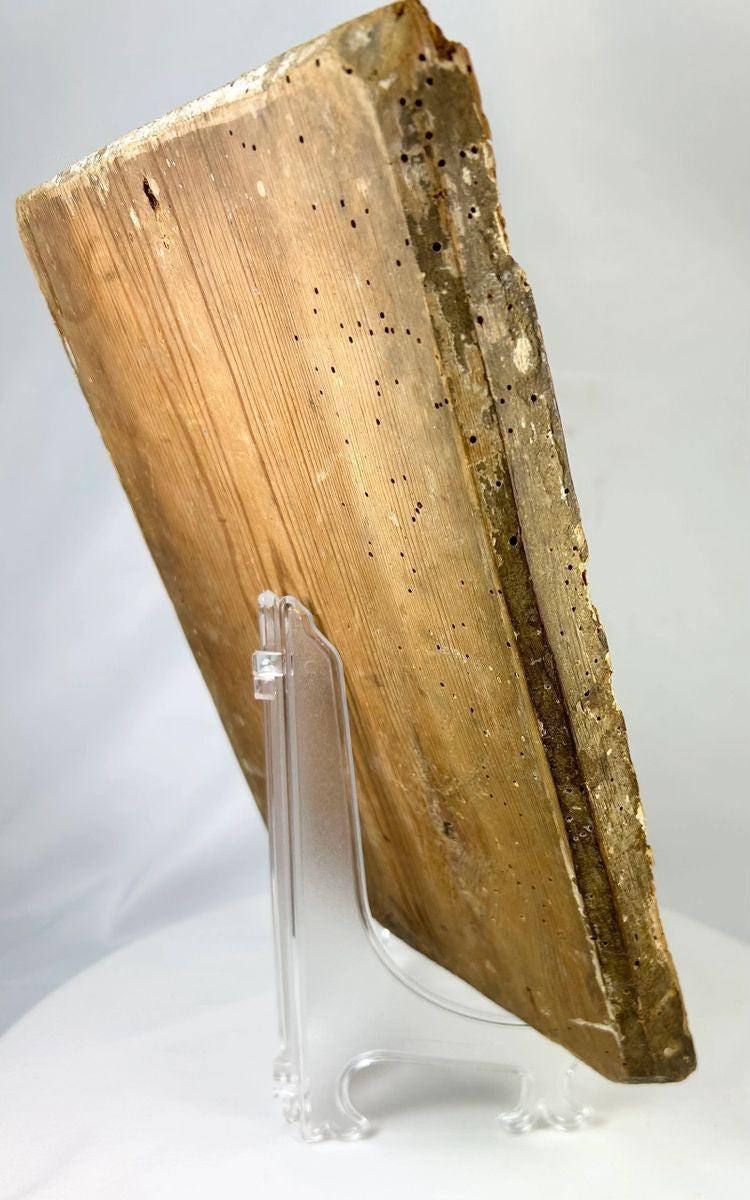 Back and angled view of an 18th-century Russian Orthodox icon showing the aged wooden panel with natural wear and historical wormholes.