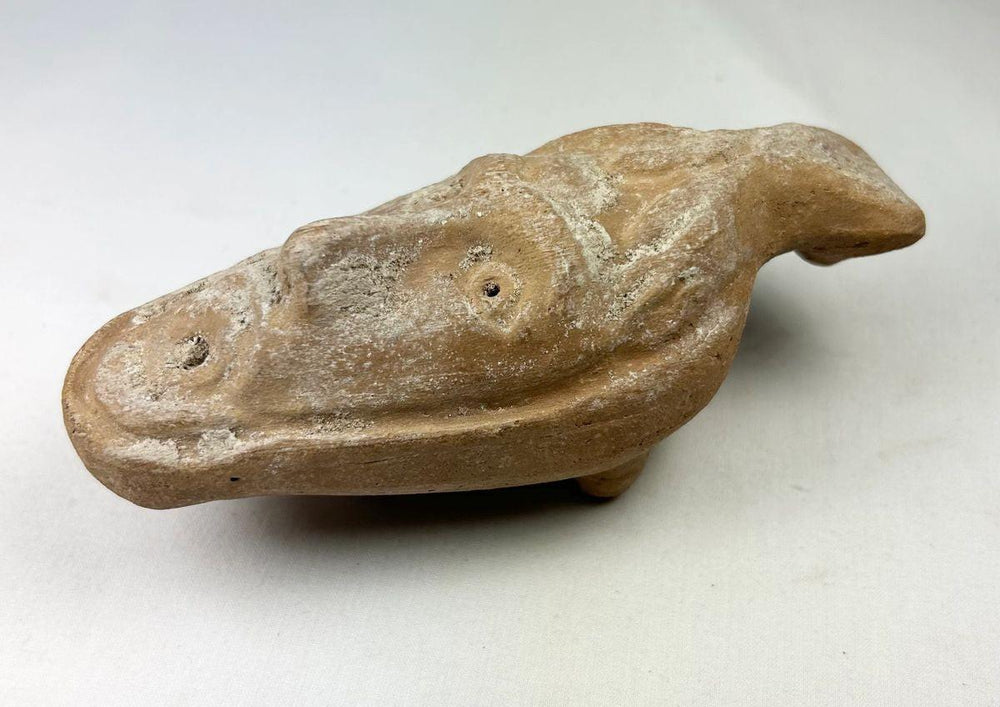 Molded face Byzantine oil lamp from 5th–7th century AD