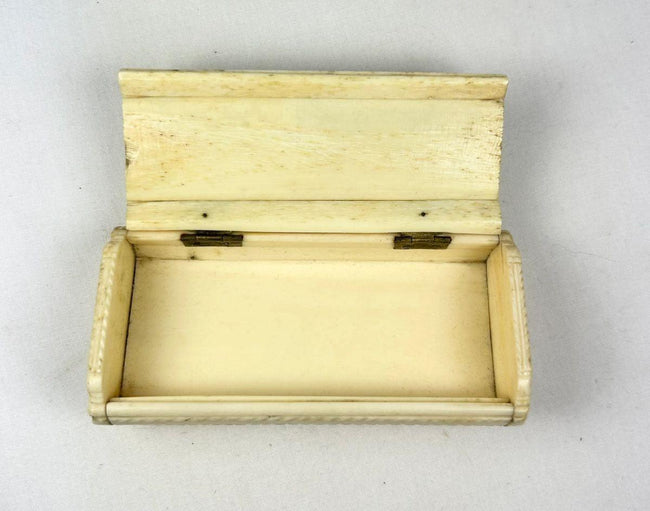 Victorian era bone keepsake box with antique portrait photographs and brass hinged lid