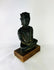 Museum-quality bronze Buddha statue with rich patina and devotional form