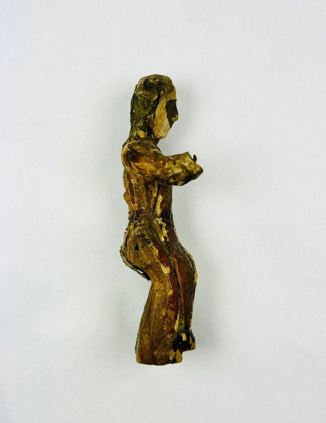 17th-century Spanish Colonial devotional santo carved in wood, showing aged surface and religious detailing