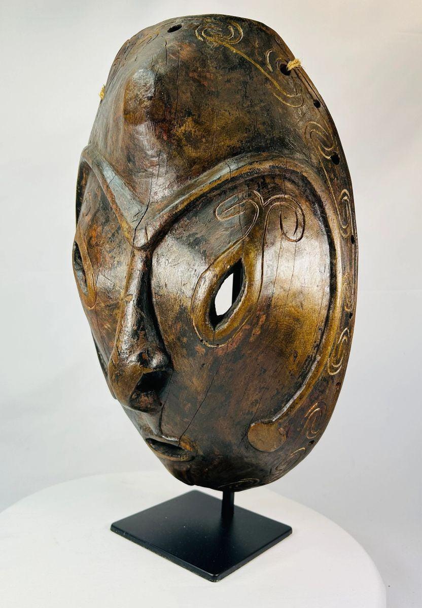 Authentic Sepik River ceremonial mask showing natural aged patina