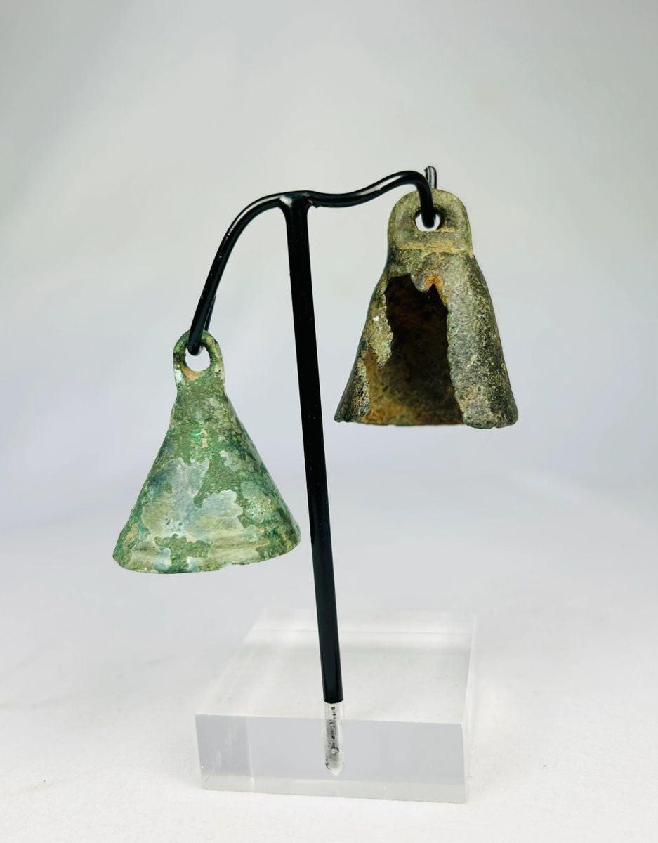 Roman harness or ritual bell in cast bronze, displaying natural burial patina and conical shape