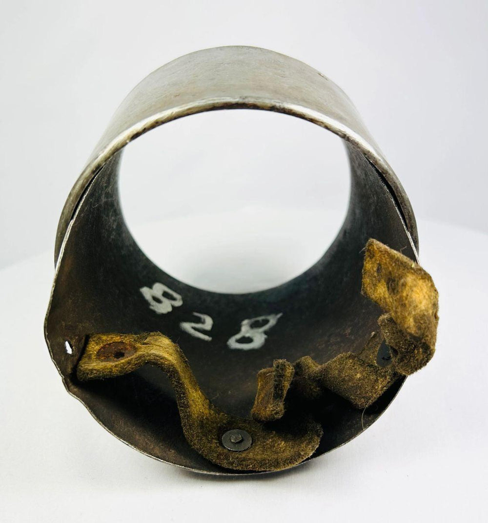 Museum-style display of a 17th century European steel siege armor arm component