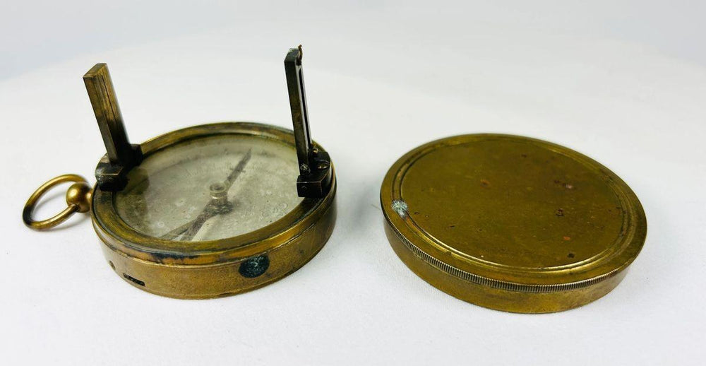 French 19th-century antique compass with brass construction and vanes