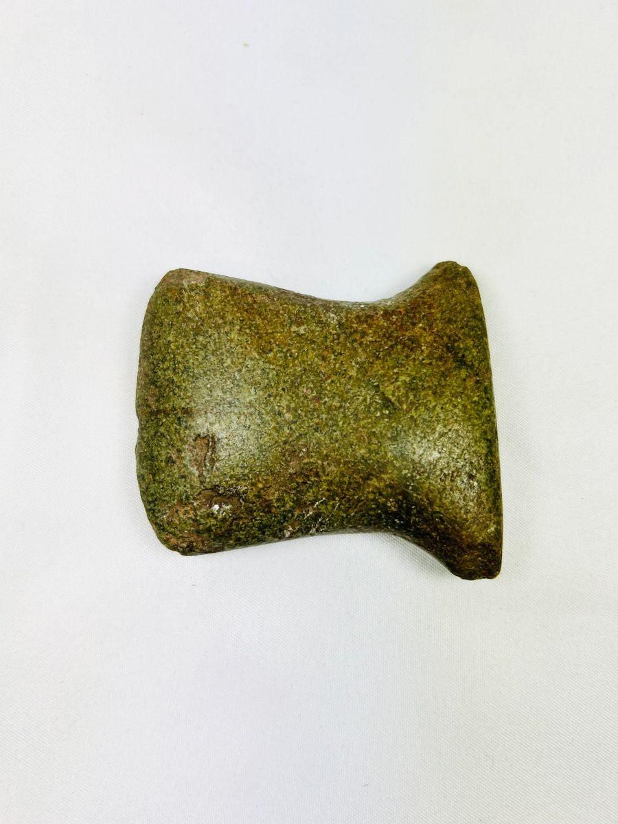 Pre-Columbian notched axe from Ecuador/Peru, showing wear from daily utilitarian use.