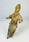 Angled view of a Pre-Columbian ritual figurine displaying natural patina and surface texture