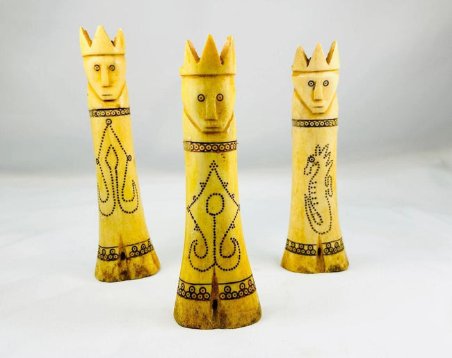 Antique Indonesian lime containers with intricate scrimshaw motifs and royal lids