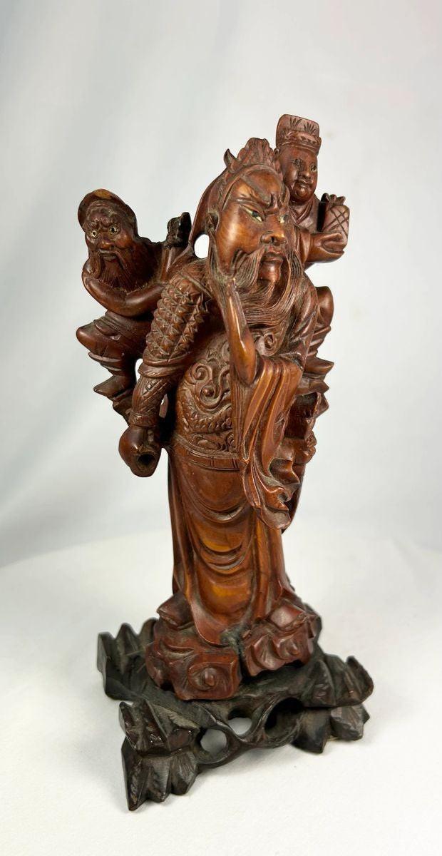 Traditional Qing Dynasty wood sculpture with carved base and polished patina