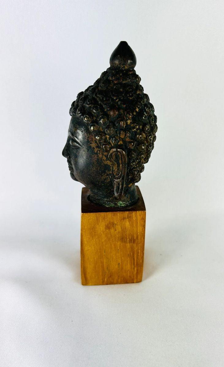 Southeast Asian bronze Buddha head devotional art Theravāda Buddhist tradition