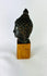 Southeast Asian bronze Buddha head devotional art Theravāda Buddhist tradition