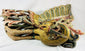 Detailed close-up of Qing Dynasty phoenix relief sculpture carved from camphor wood, with vivid red, blue, and gold gilded plumage representing the Fenghuang – Relic and Rarity.