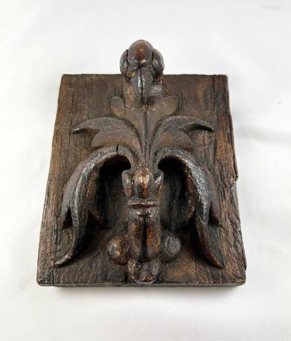 Renaissance-era European devotional panel featuring the Pelican in Her Piety symbol, carved wood with residual paint