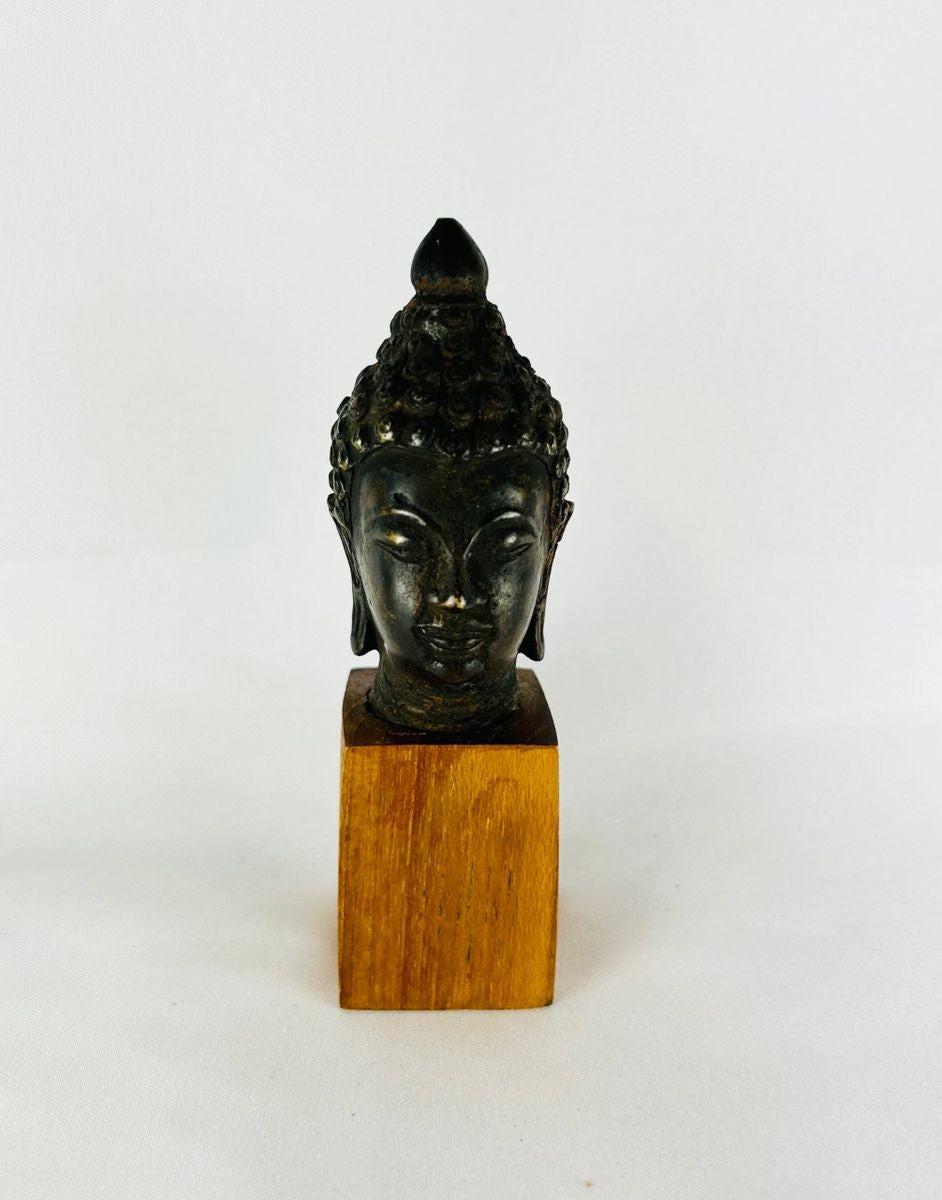 Authentic Southeast Asian bronze Buddha head 18th–19th century CE with serene expression and aged patina