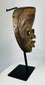 Ceremonial Baule mask from Ivory Coast with refined facial symmetry and scarification marks