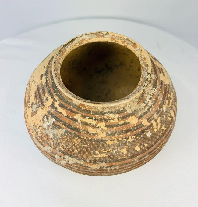 Close-up of Indus Valley ceramic jar showing painted geometric detail