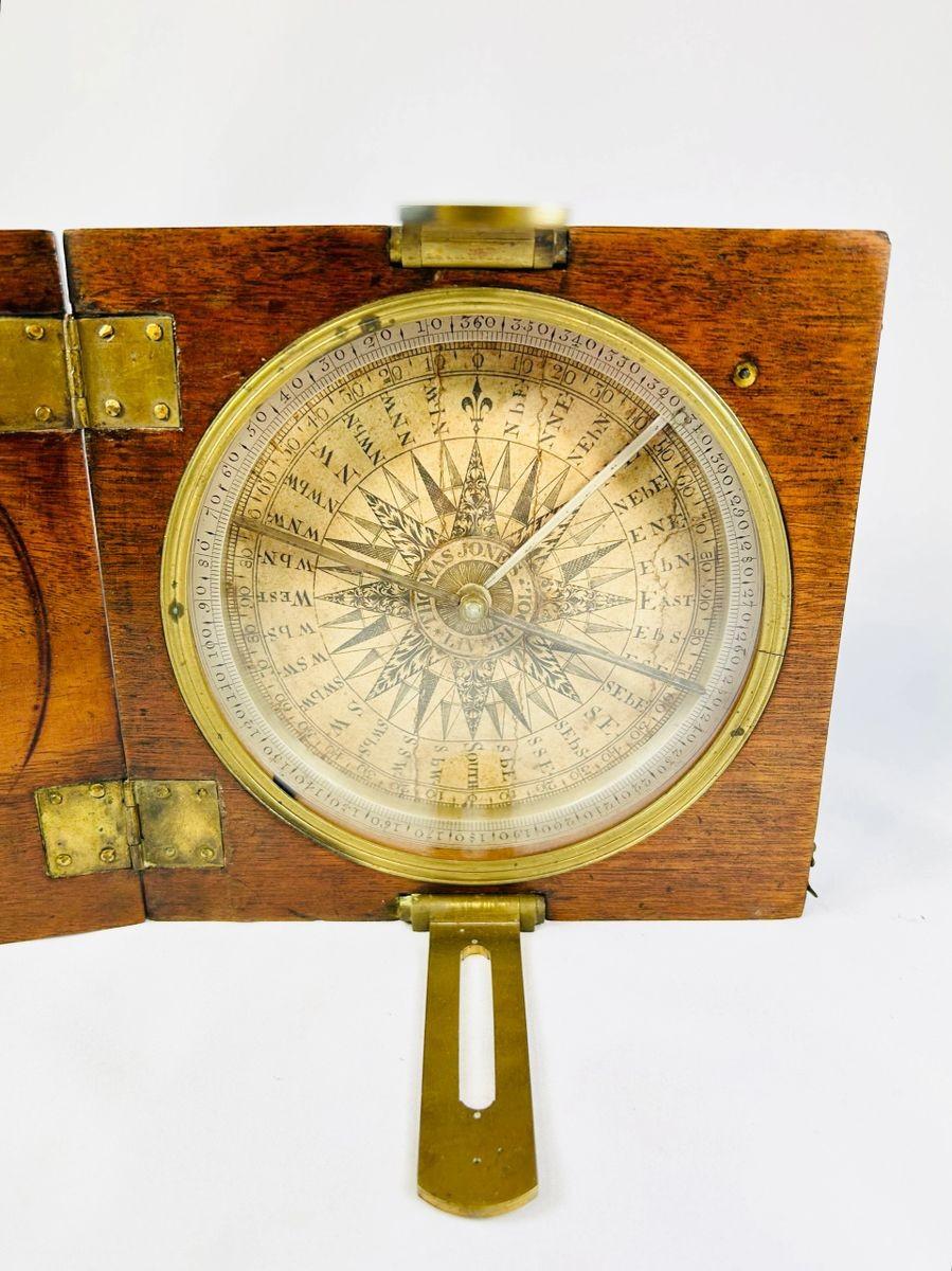 Mid-19th century alidade compass in walnut case with brass sighting vane, open display view