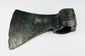 Antique European iron axe head showing maker’s mark and aged surface patina