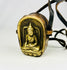 Tibetan Gau prayer amulet box showing Shakyamuni Buddha seated in meditation.