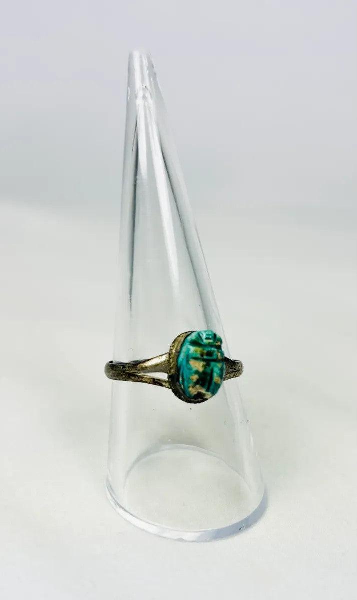bronze mounted egyptian scarab amulet ring white background