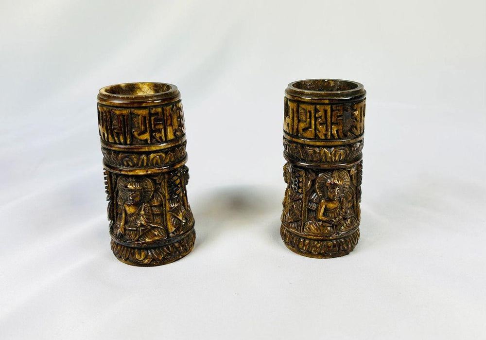 Pair of 19th-century Tibetan thigh bone prayer wheel cylinders with carved Buddhist deities and sacred inscriptions, authentic ritual artifacts from Relic and Rarity.