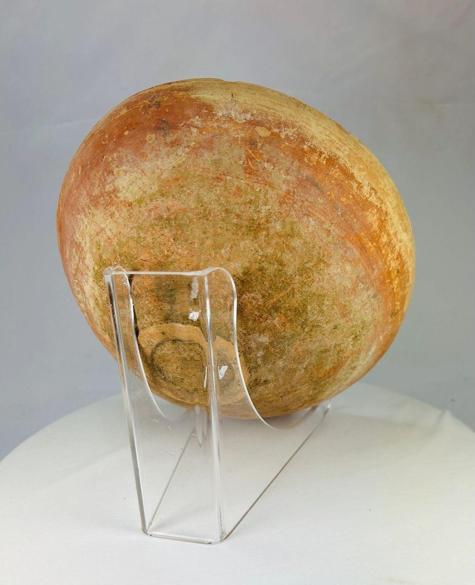 Rear view of ancient Indus Valley pottery vessel with black-painted concentric designs.