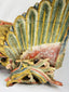 Close-up of gilded phoenix wing from Qing Dynasty camphor wood relief, showing layered carving, polychrome pigments, and ornate scrollwork base – Relic and Rarity.