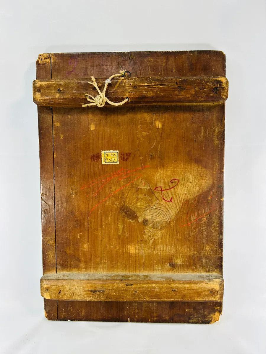 Back of antique Orthodox icon panel with wooden cross-bracing, aged patina, rope hanger and remnants of old label