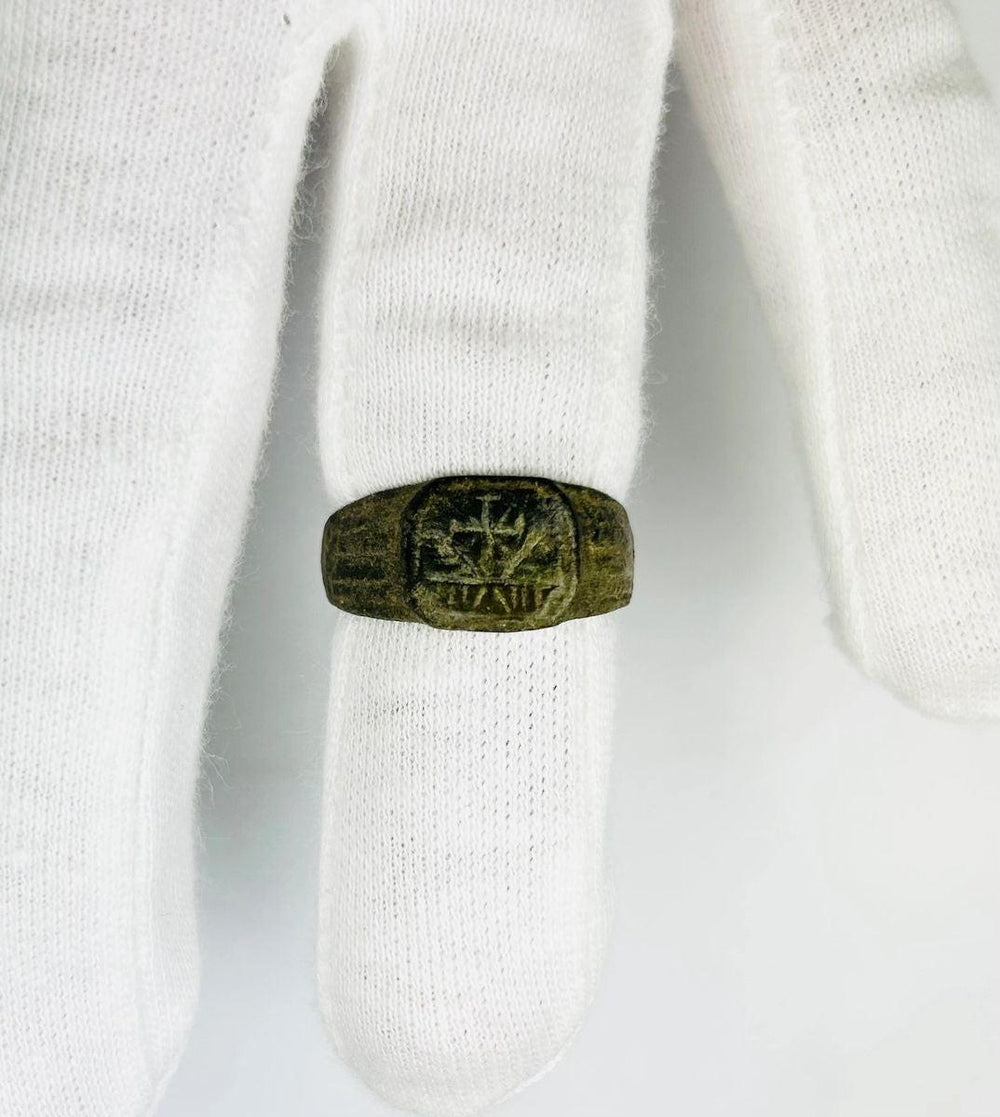 Ancient Roman bronze ring with Christogram (Chi-Rho) engraving, 1st–4th Century CE, authentic early Christian artifact, displayed at Relic and Rarity.