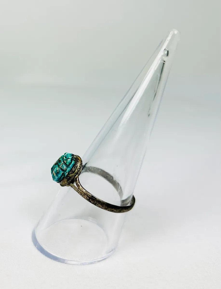 ancient egyptian turquoise green scarab ring on display stand