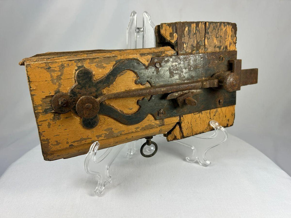 Historic colonial wooden lock showing traditional peg-joined construction