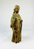 Early colonial hand-carved wooden saint sculpture with surface wear, missing arm, and traces of original painted decoration