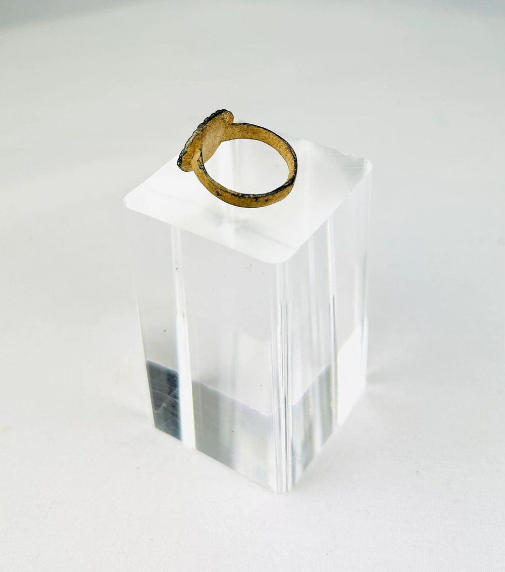 Side view of an authentic Roman bronze ring showing centuries-old burial patina