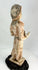 Low-fired terracotta Tang Dynasty tomb figure with serene expression and mineral burial patina