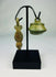 Museum-quality Ancient Roman bronze pendant photographed against a neutral background