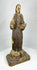 Detailed view of the hands and gesture of a Spanish Colonial santo religious sculpture