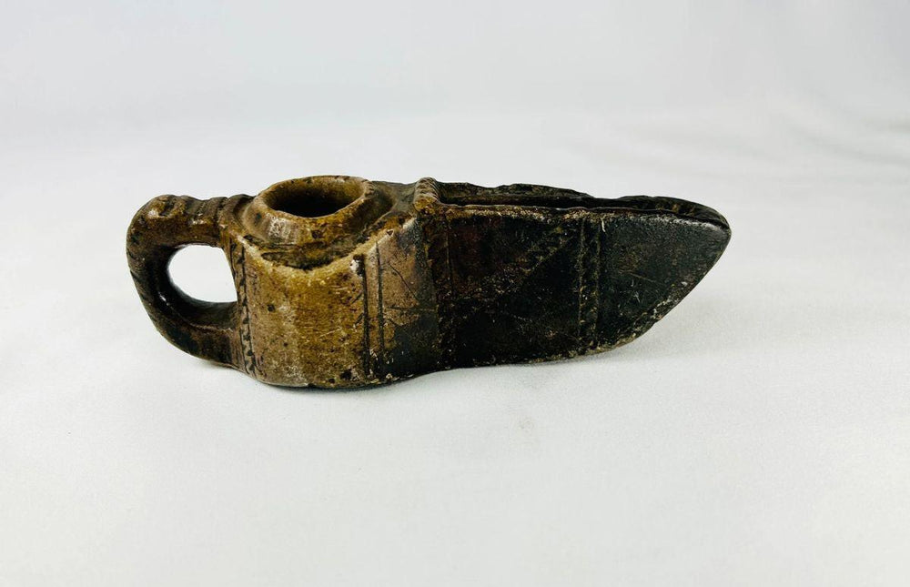 Ancient Islamic stone oil lamp with geometric incised design