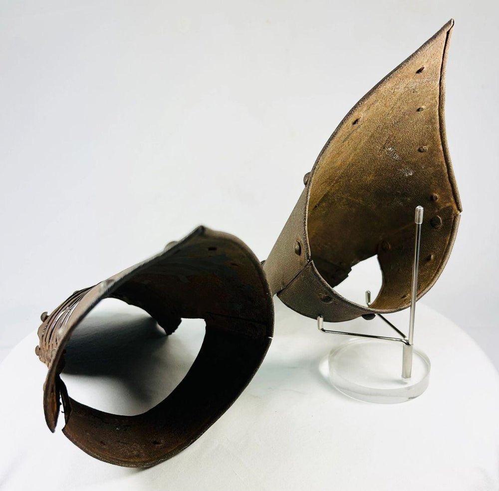 Top-down photo of Gothic armor gauntlets showing finger plate construction.