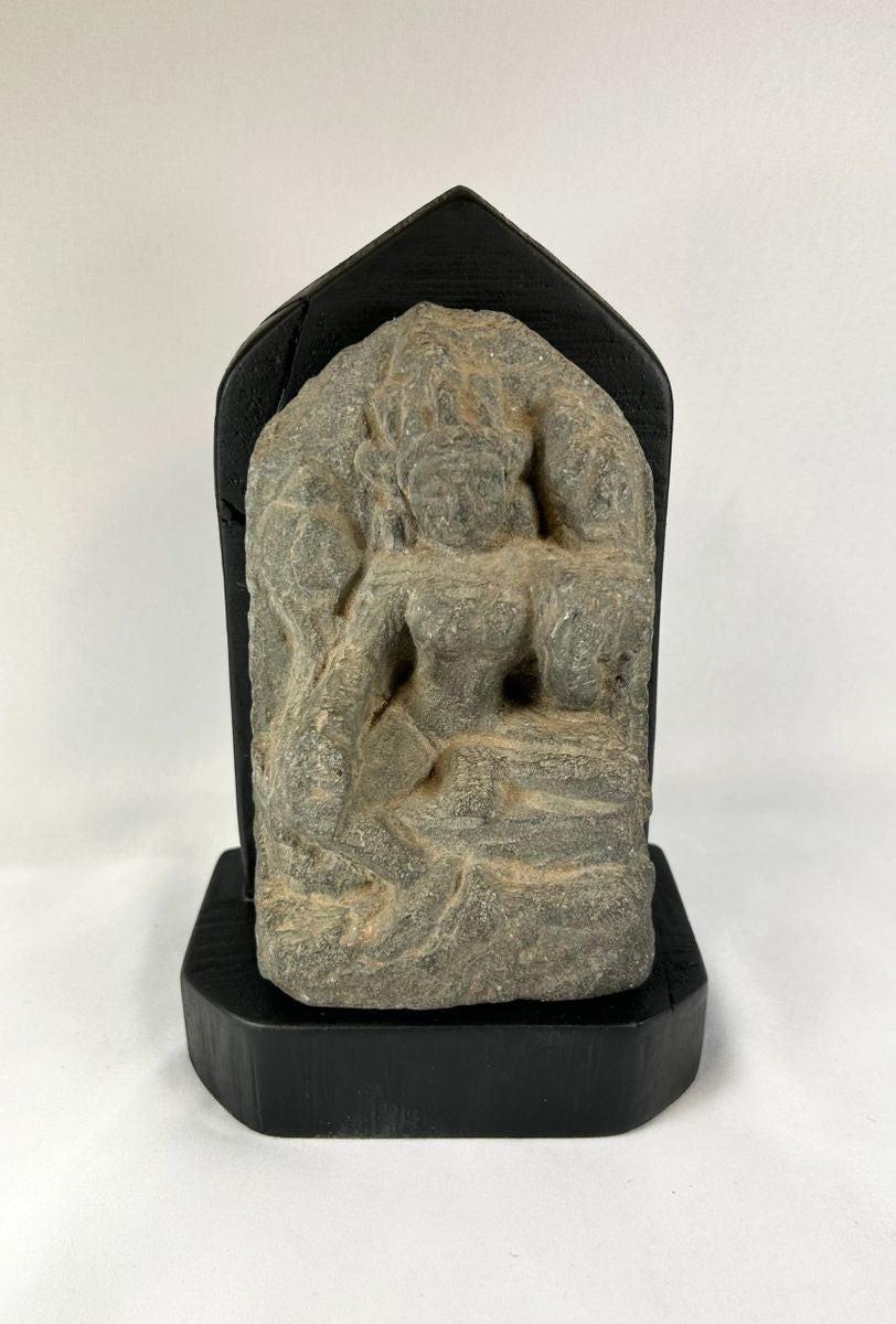 Ancient Tibetan stone stele of Tara with serene expression and carved sacred details